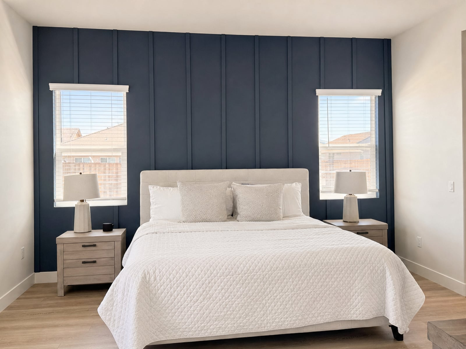 Board & Batten Wall: Navy board & batten behind the bed