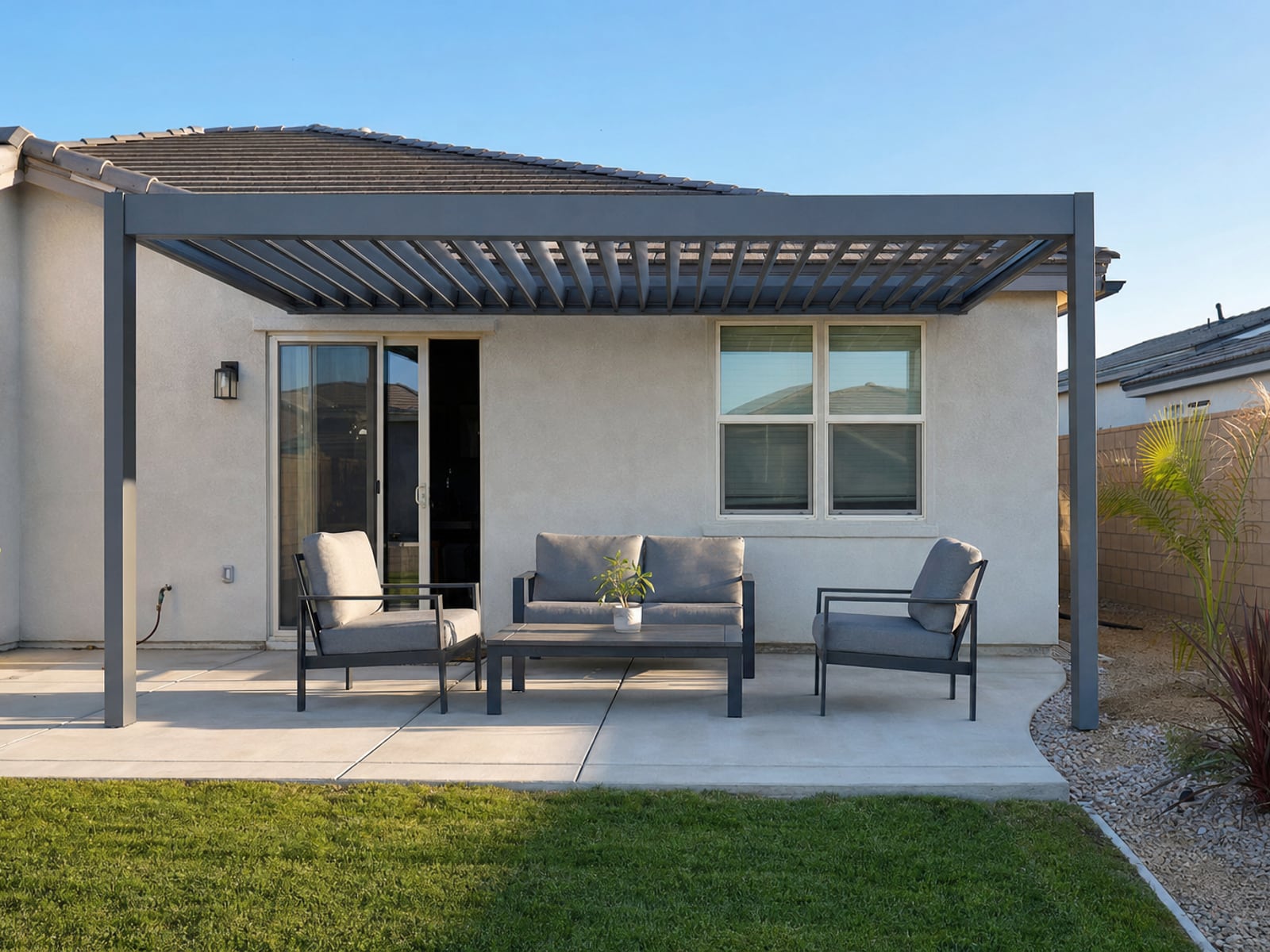 Louvered Aluminum Pergola: Gray louvered pergola, louvers half open