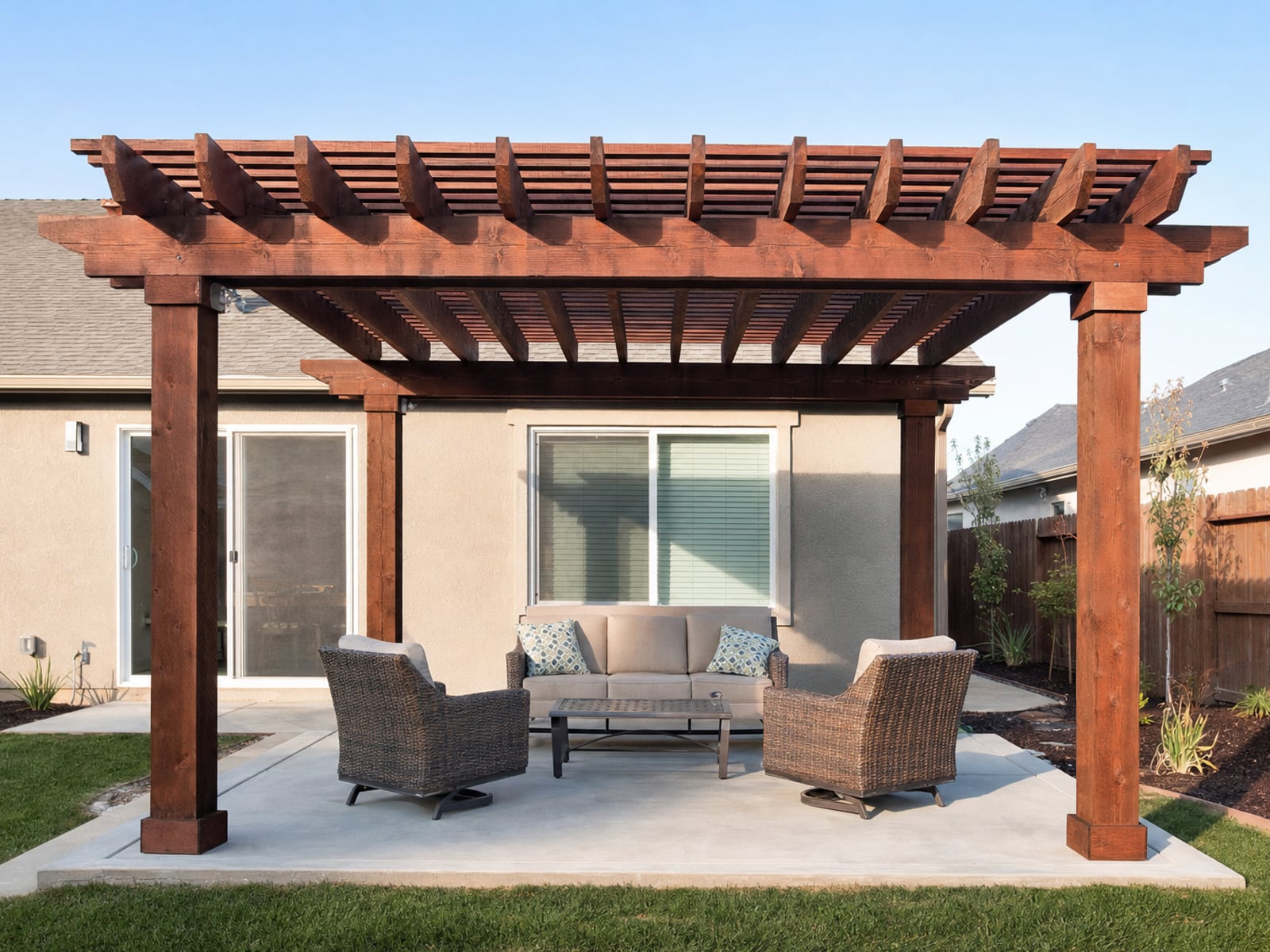 Wood Pergola: Stained wood pergola over the patio