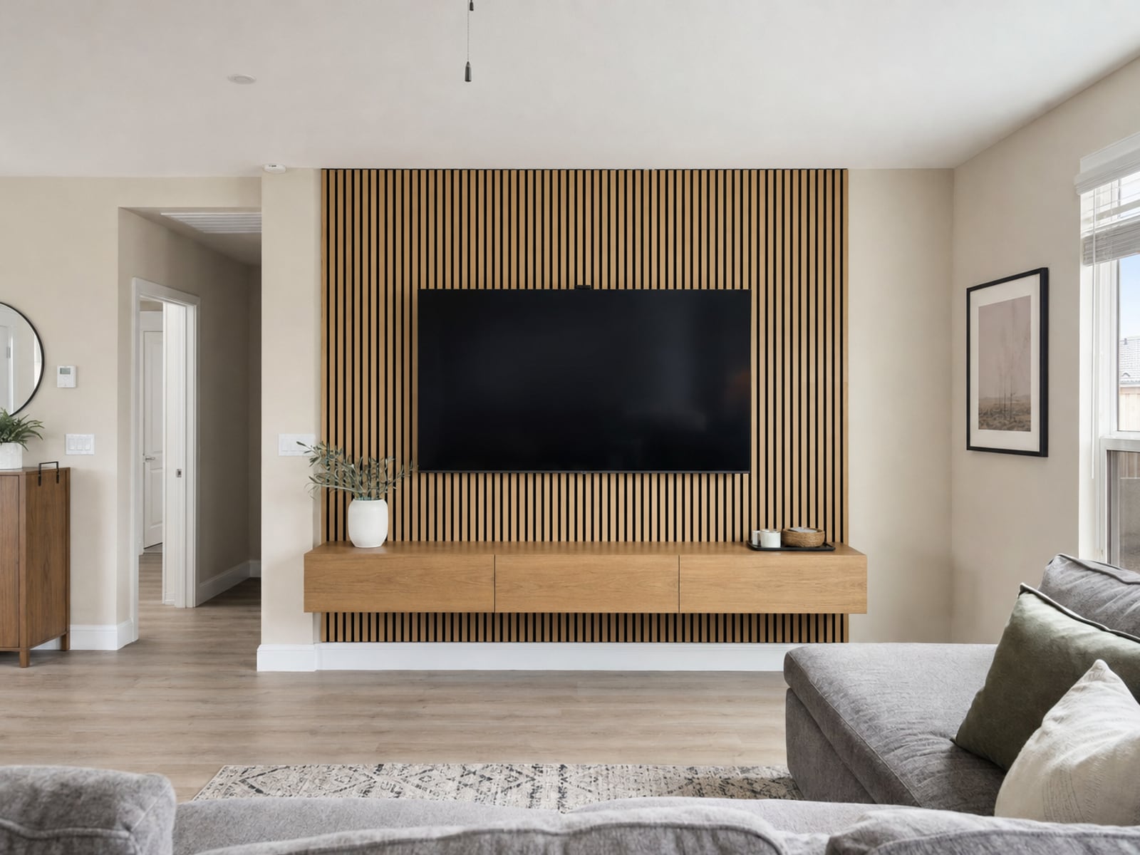 Wood Slat TV Wall: Oak slats with 65" TV and floating console